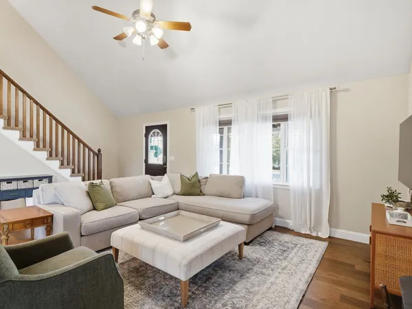 a living room with furniture and a rug
