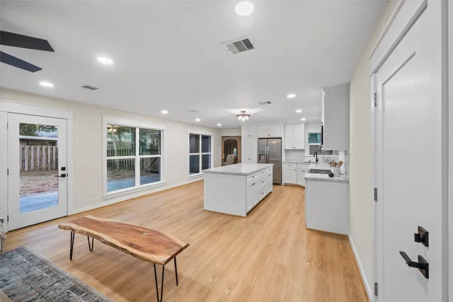 a bathroom with a double vanity sink a mirror and a shower