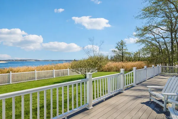 a view of a balcony with wooden floor