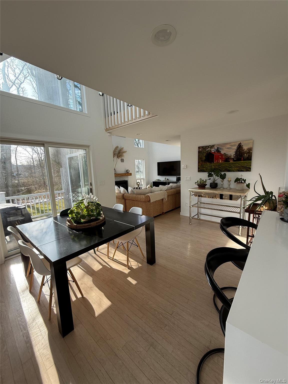 845 Budds Pond Road Southold, NY 11971 - Photo 3 of 9 a living room with furniture a flat screen tv and a table