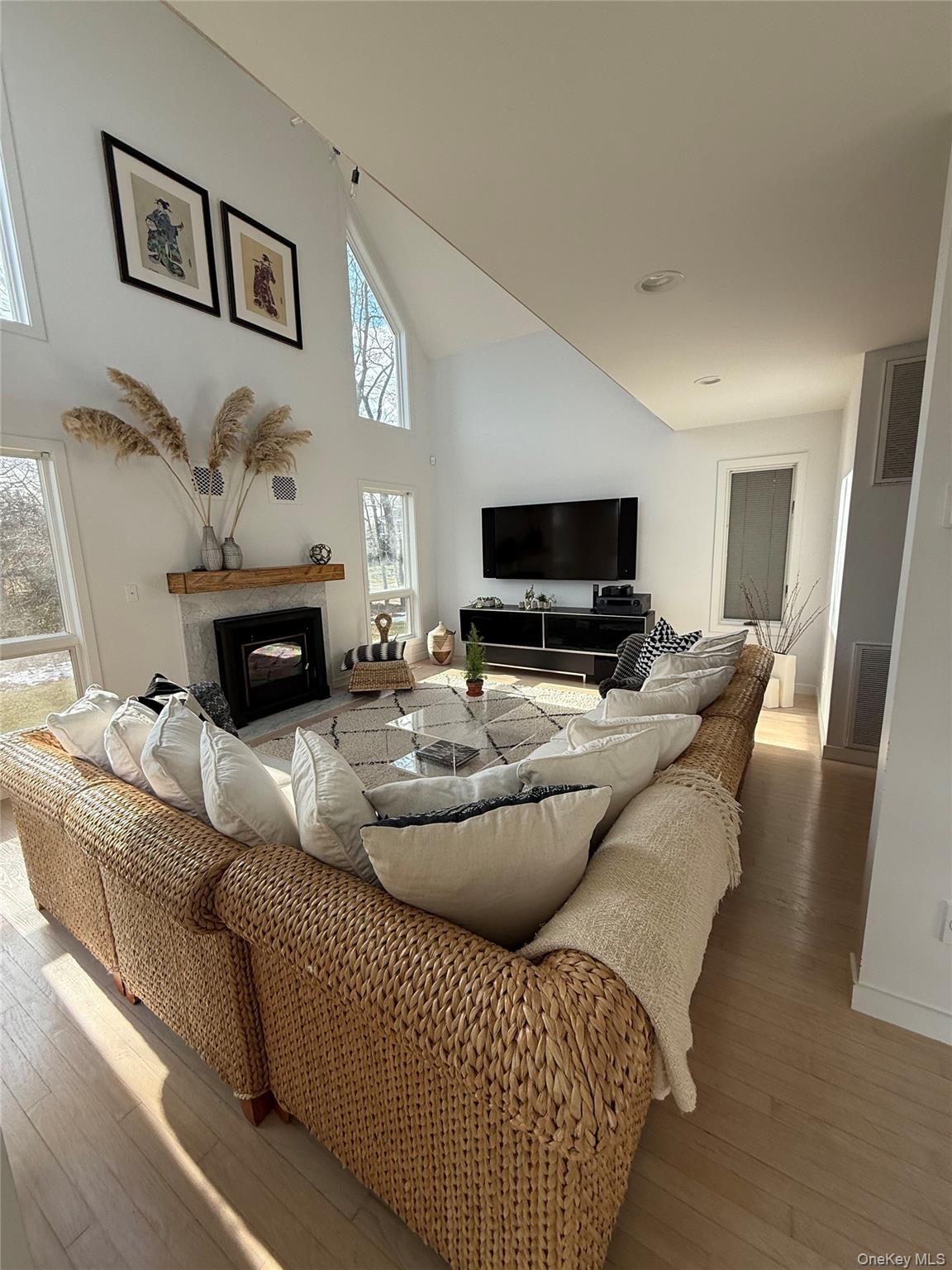 845 Budds Pond Road Southold, NY 11971 - Photo 4 of 9 a living room with furniture and a flat screen tv