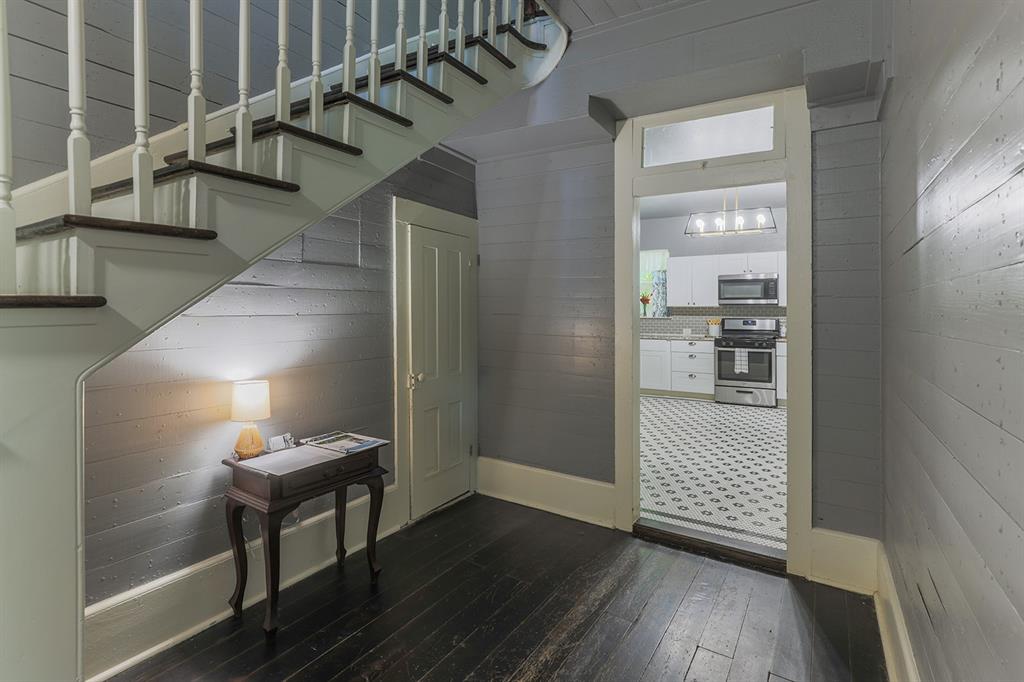 453 East Marshall Street Van Alstyne, TX 75495 - Photo 8 of 30 a view of entryway and hall with wooden floor