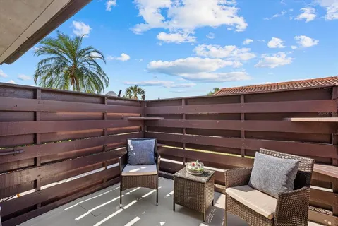 a view of patio with a table and chairs