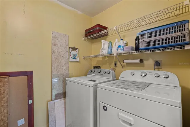 a utility room with dryer and washer