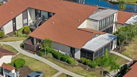 an aerial view of house with yard