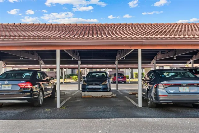 a view of a garage with parked cars