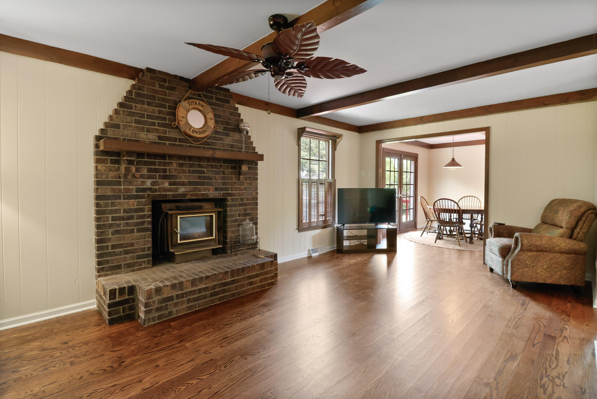 8670 Howard Street St. John, IN 46373 - Photo 12 of 34 a living room with furniture a fireplace and wooden floor