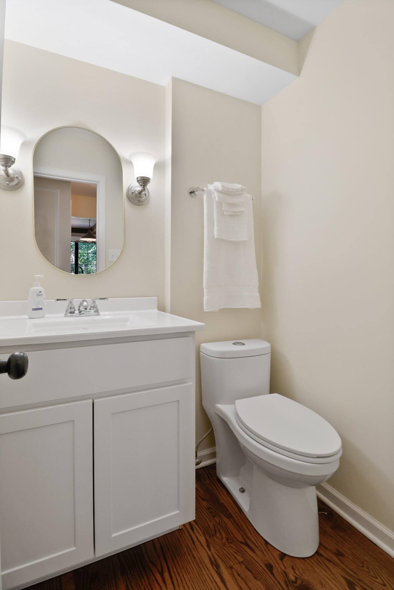 8670 Howard Street St. John, IN 46373 - Photo 14 of 34 a bathroom with a sink toilet a mirror and vanity