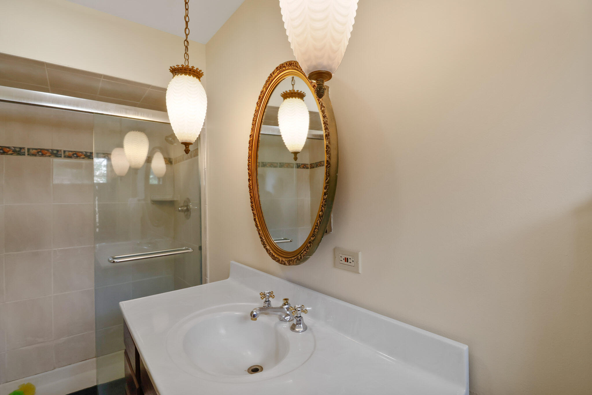 8670 Howard Street St. John, IN 46373 - Photo 19 of 34 a bathroom with a sink and a mirror