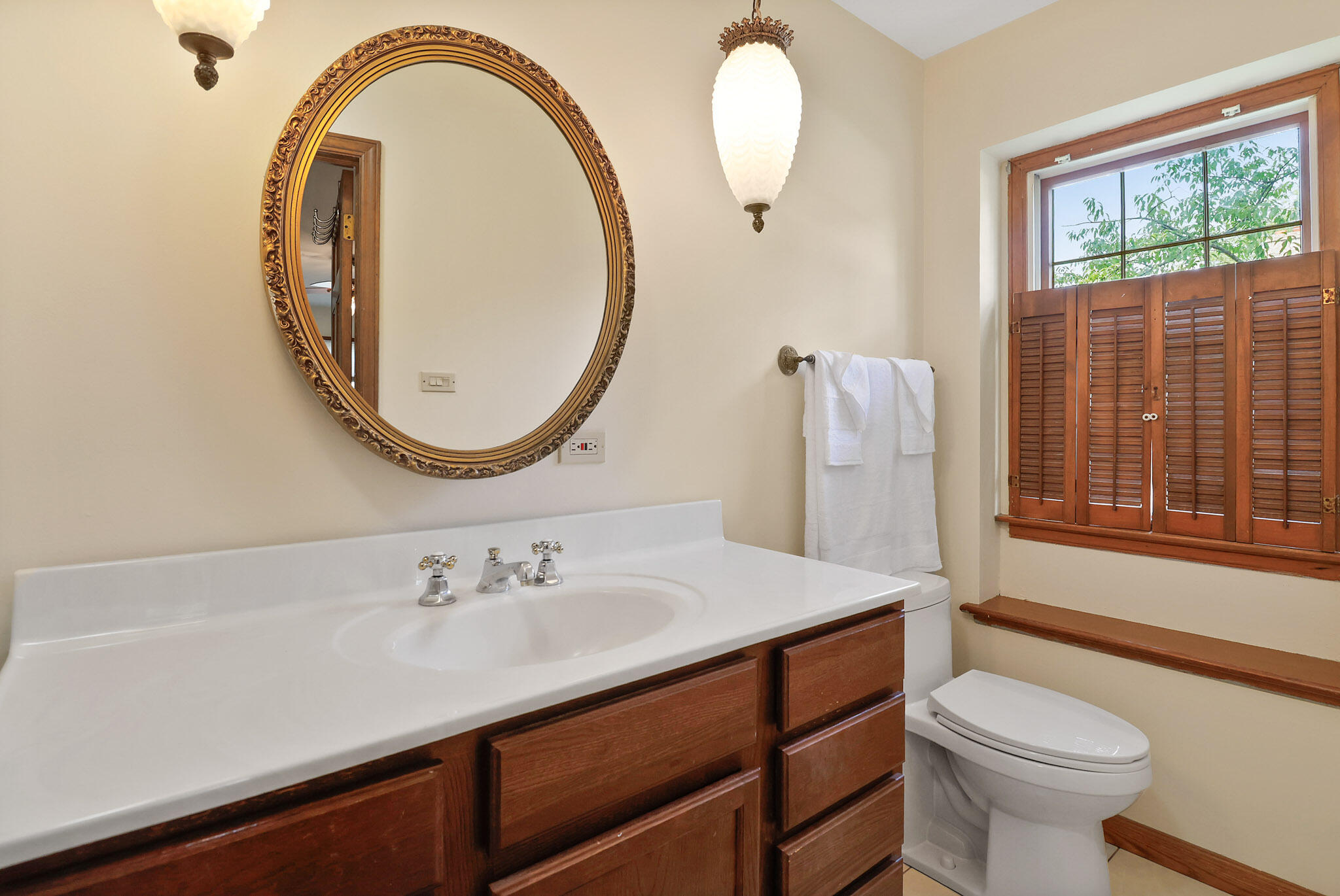 8670 Howard Street St. John, IN 46373 - Photo 20 of 34 a bathroom with a sink a toilet and a mirror
