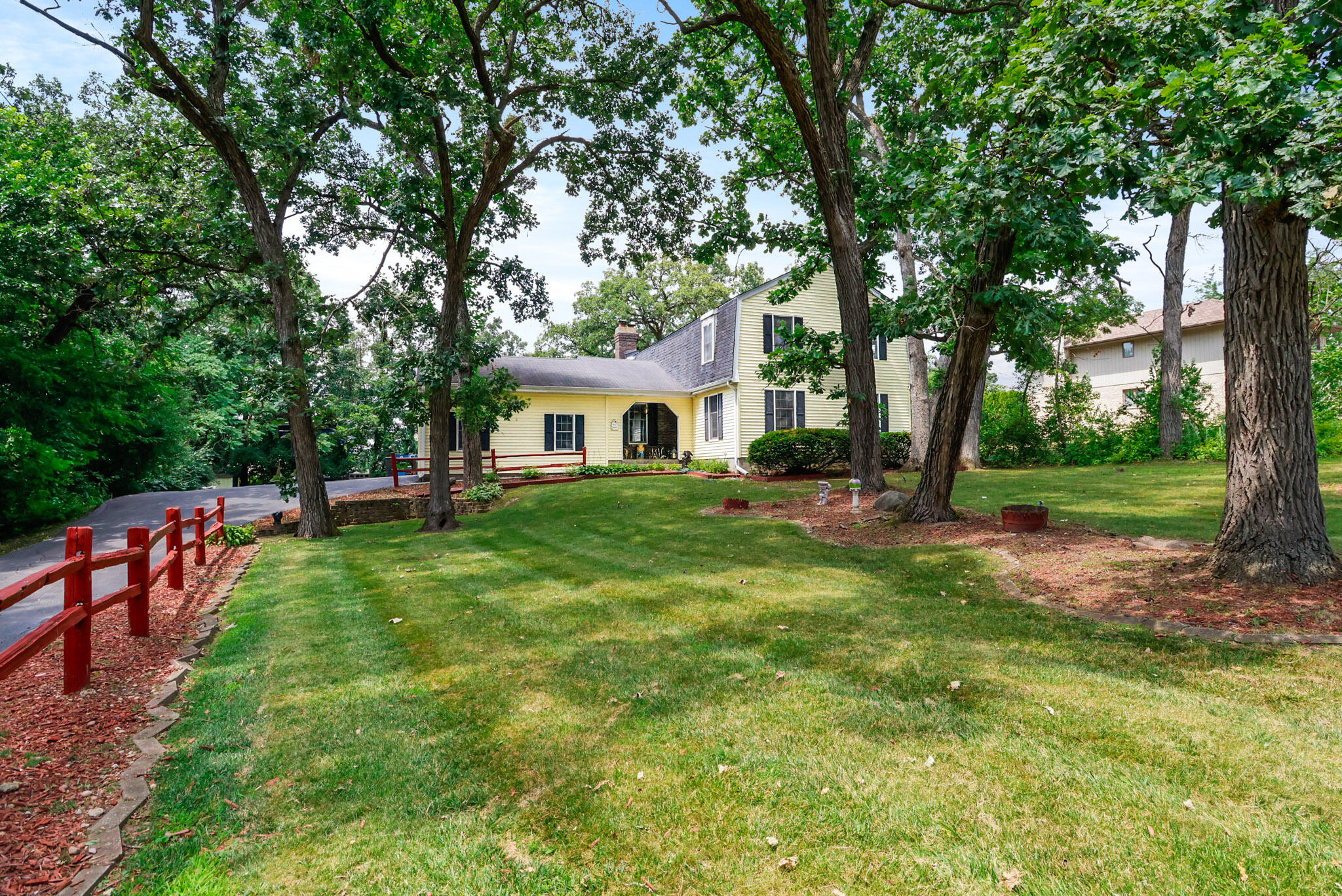 8670 Howard Street St. John, IN 46373 - Photo 2 of 34 a view of an house with backyard space and garden
