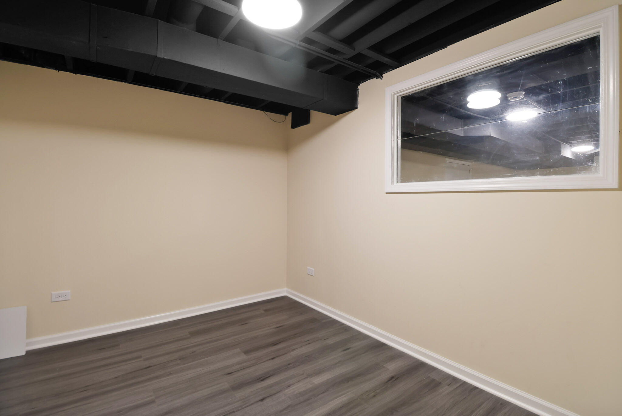 8670 Howard Street St. John, IN 46373 - Photo 27 of 34 a view of empty room with wooden floor and fan
