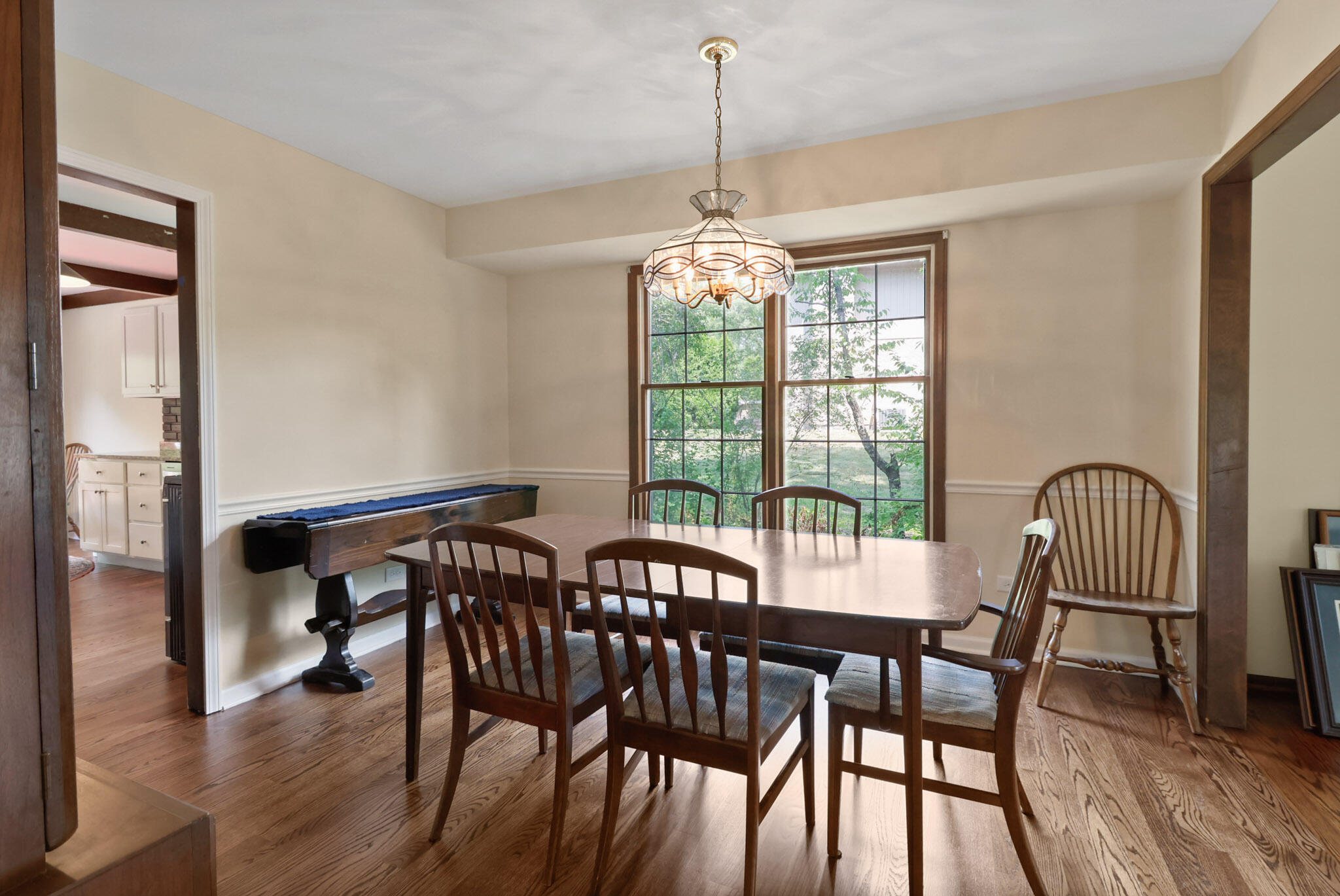 8670 Howard Street St. John, IN 46373 - Photo 10 of 34 a view of a dining room with furniture window and wooden floor