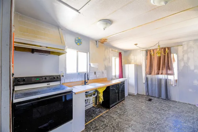 a kitchen that has a stove and a microwave