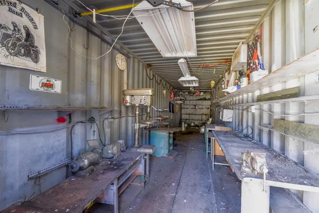 a utility room with lots of wooden furniture and windows