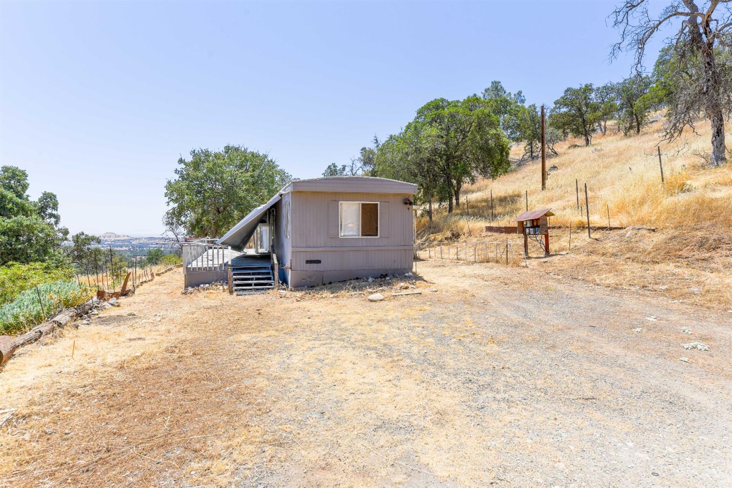 3101 Trower Road Catheys Valley, CA 95306 - Photo 6 of 29 a view of a house with a patio