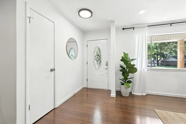 a view of entryway with wooden floor