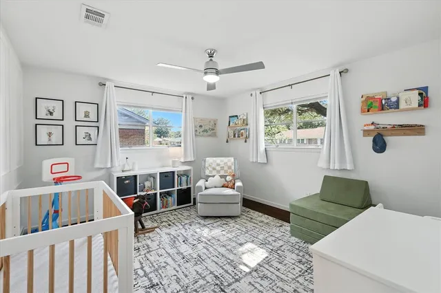 a bedroom with furniture and a window