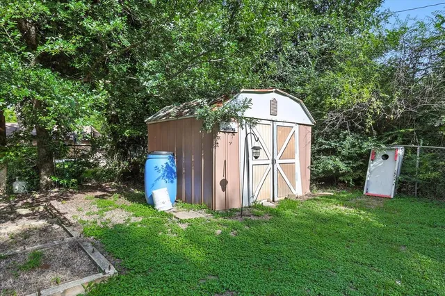 a view of a park with large trees