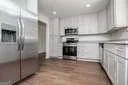 a kitchen with a stove and a microwave
