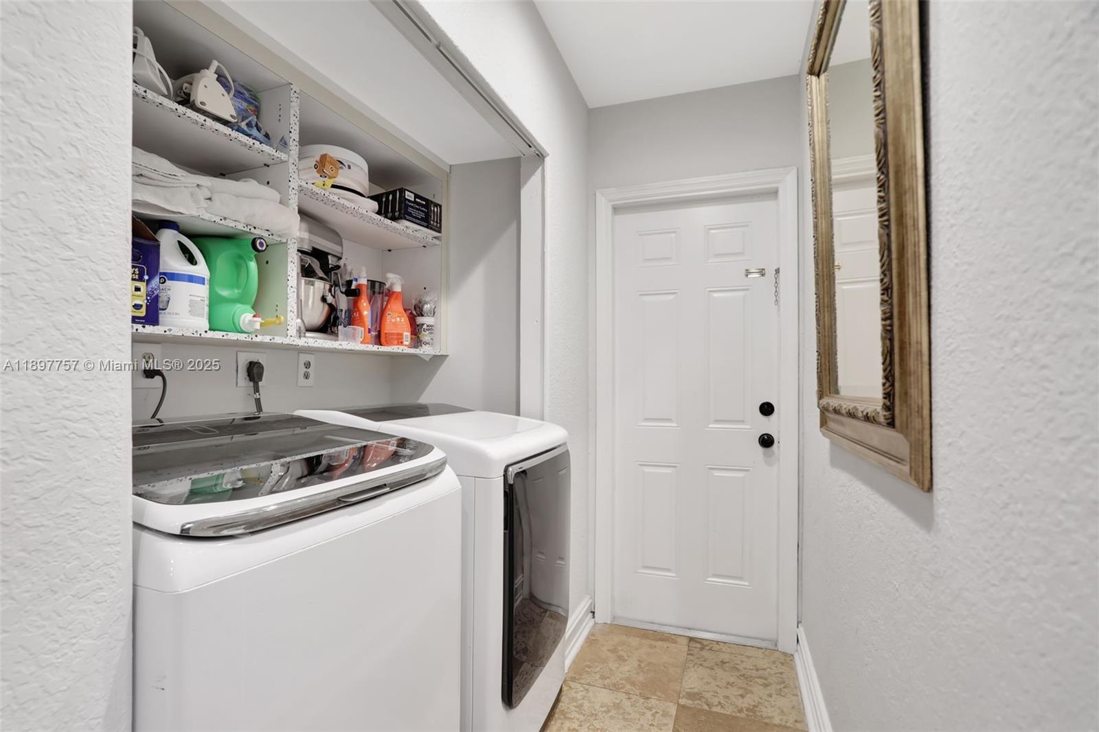 1128 West Cypress Drive, Unit V15 Pompano Beach, FL 33069 - Photo 21 of 41 a utility room with dryer and washer