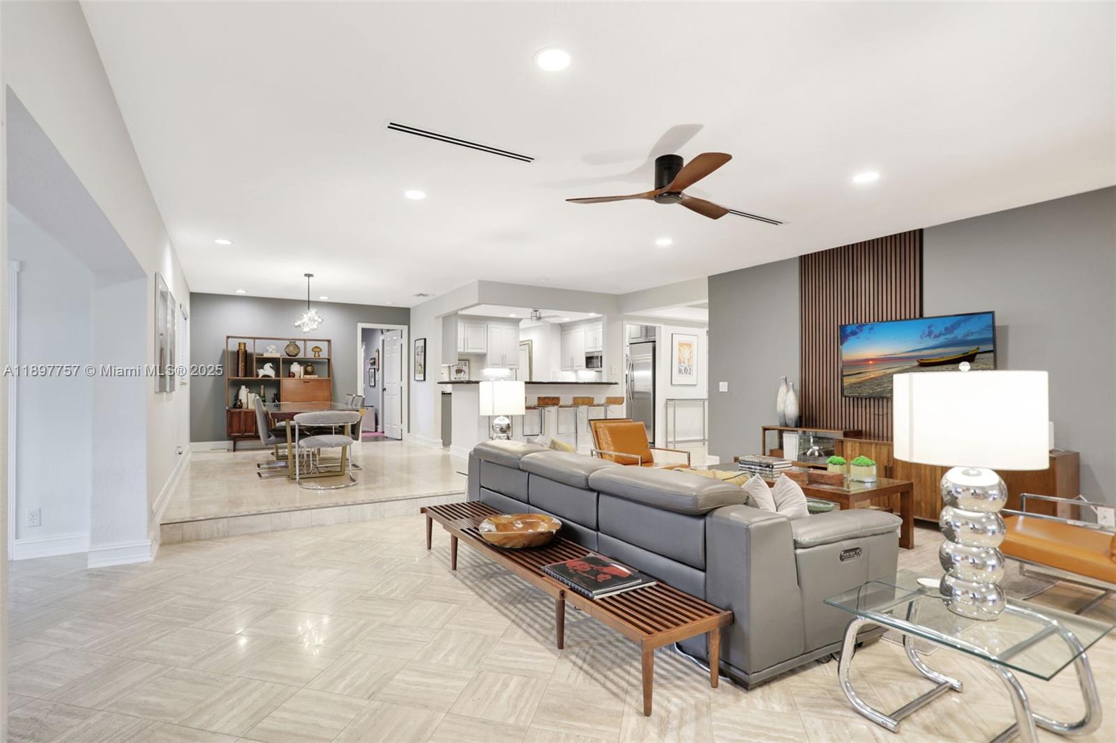 1128 West Cypress Drive, Unit V15 Pompano Beach, FL 33069 - Photo 27 of 41 a living room with furniture and kitchen view