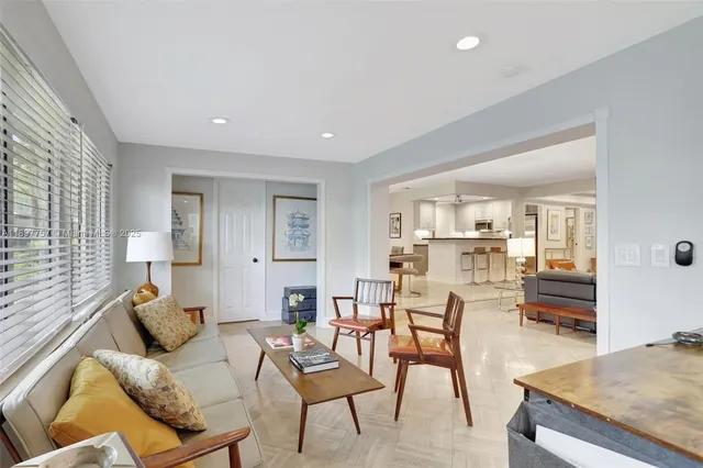 a living room with furniture and a table