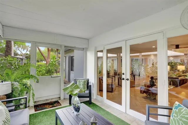 a living room with furniture and a garden