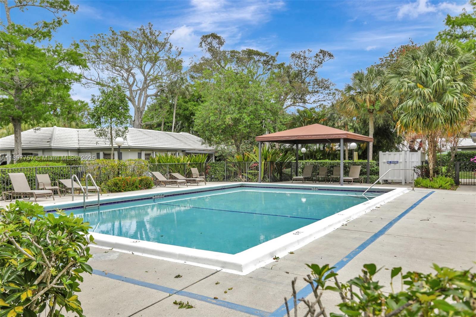 1128 West Cypress Drive, Unit V15 Pompano Beach, FL 33069 - Photo 38 of 41 a view of a swimming pool with a patio