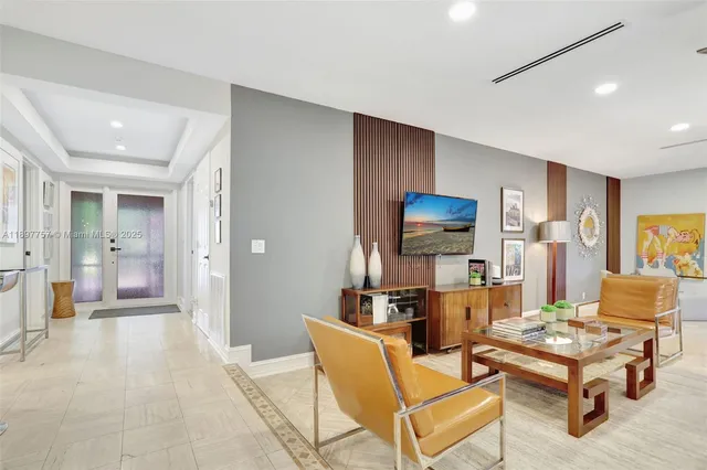 a living room with furniture and a table