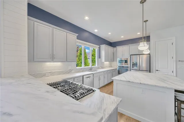 a view of a livingroom with furniture window and wooden floor