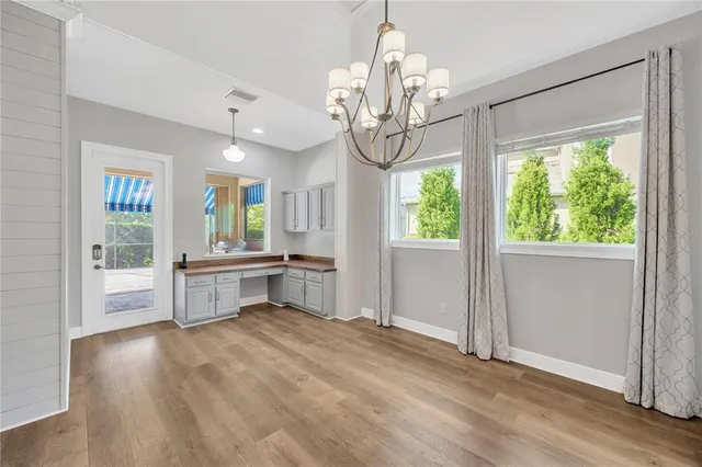 a view of kitchen with furniture and wooden floor