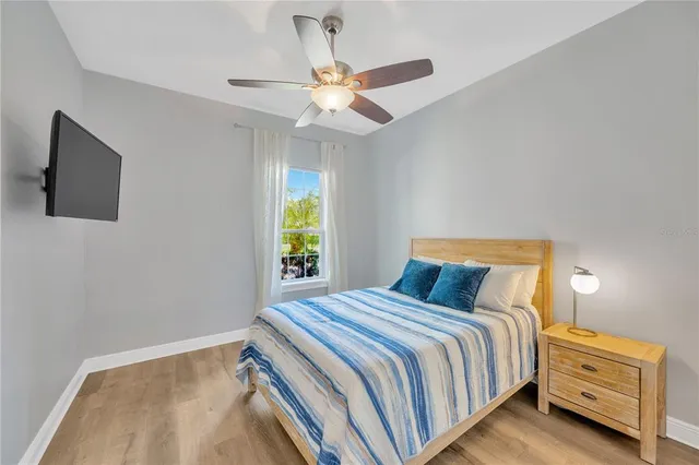 a bathroom with a granite countertop sink a toilet and bathtub