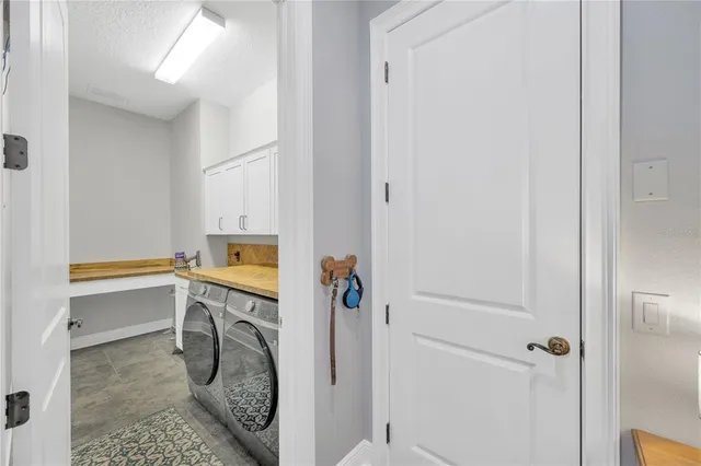 a bathroom with 2 sink bathtub and a mirror