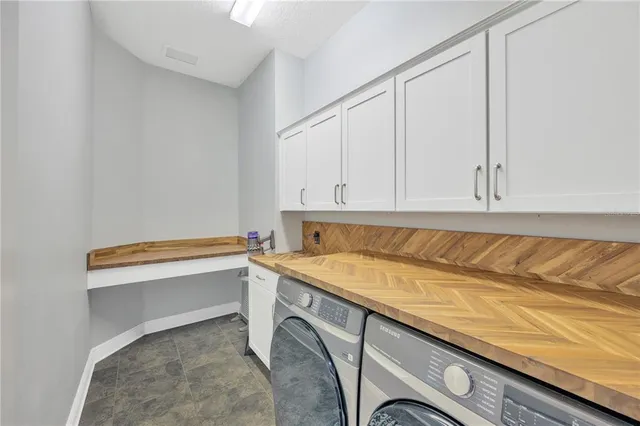 a spacious bathroom with a granite countertop tub sink and mirror