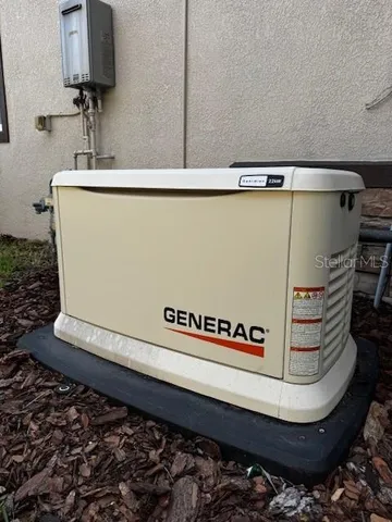 a kitchen with kitchen island granite countertop a sink stove and cabinets