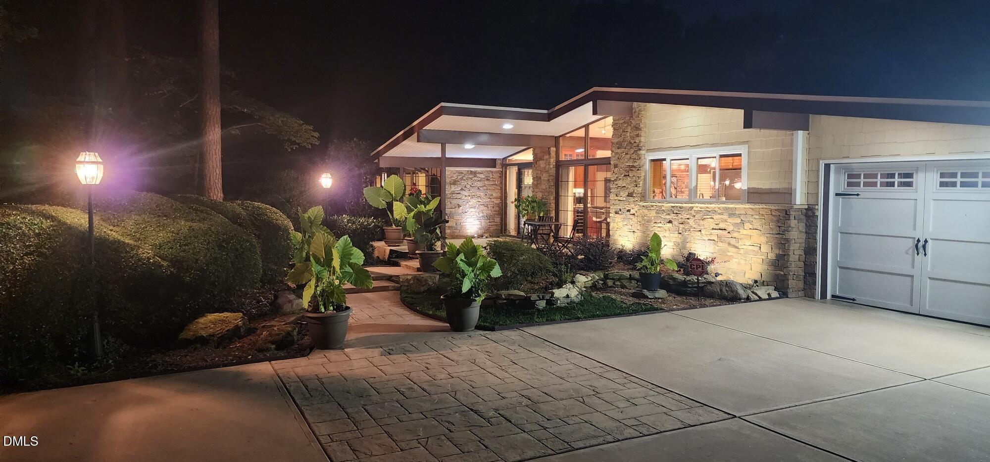 5219 Coronado Drive Raleigh, NC 27609 - Photo 11 of 100 Evening front of house 20250724_212209_r