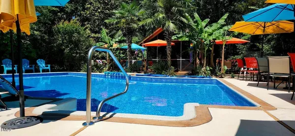 a living room with furniture wooden floor and a fireplace