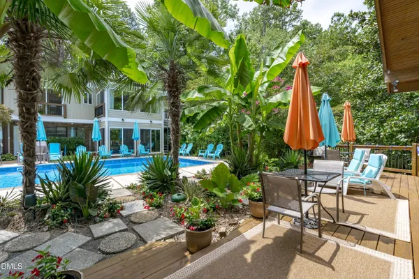 a dining room with furniture a fireplace and wooden floor