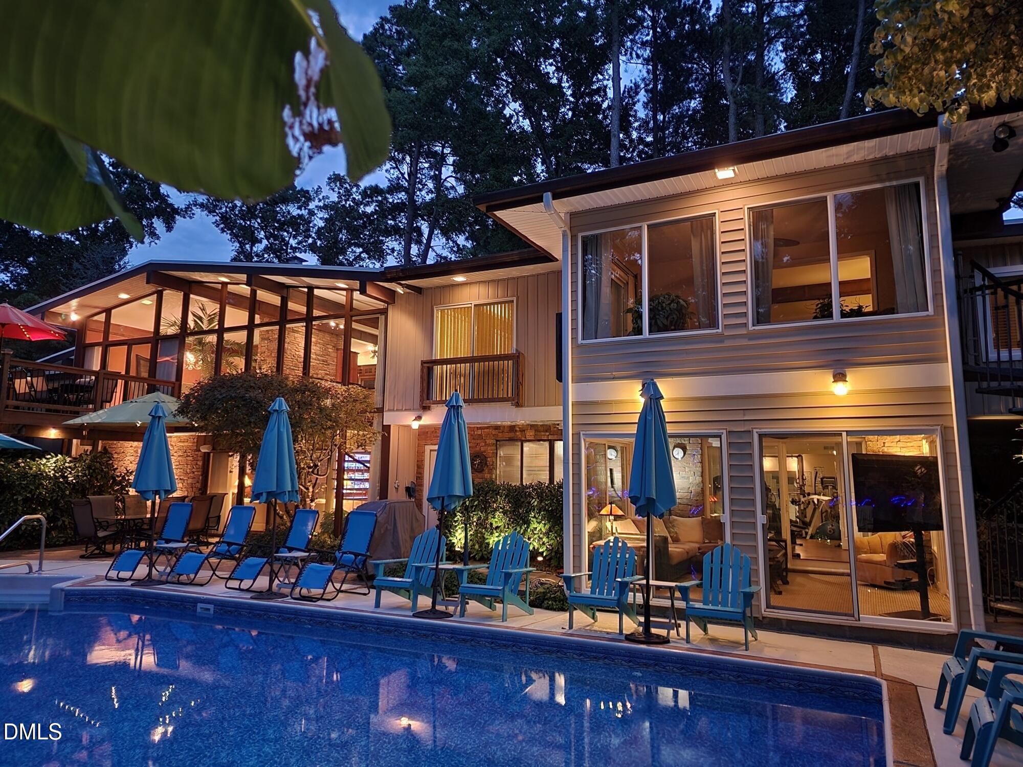 5219 Coronado Drive Raleigh, NC 27609 - Photo 37 of 100 Night time Back of house and pool 202207