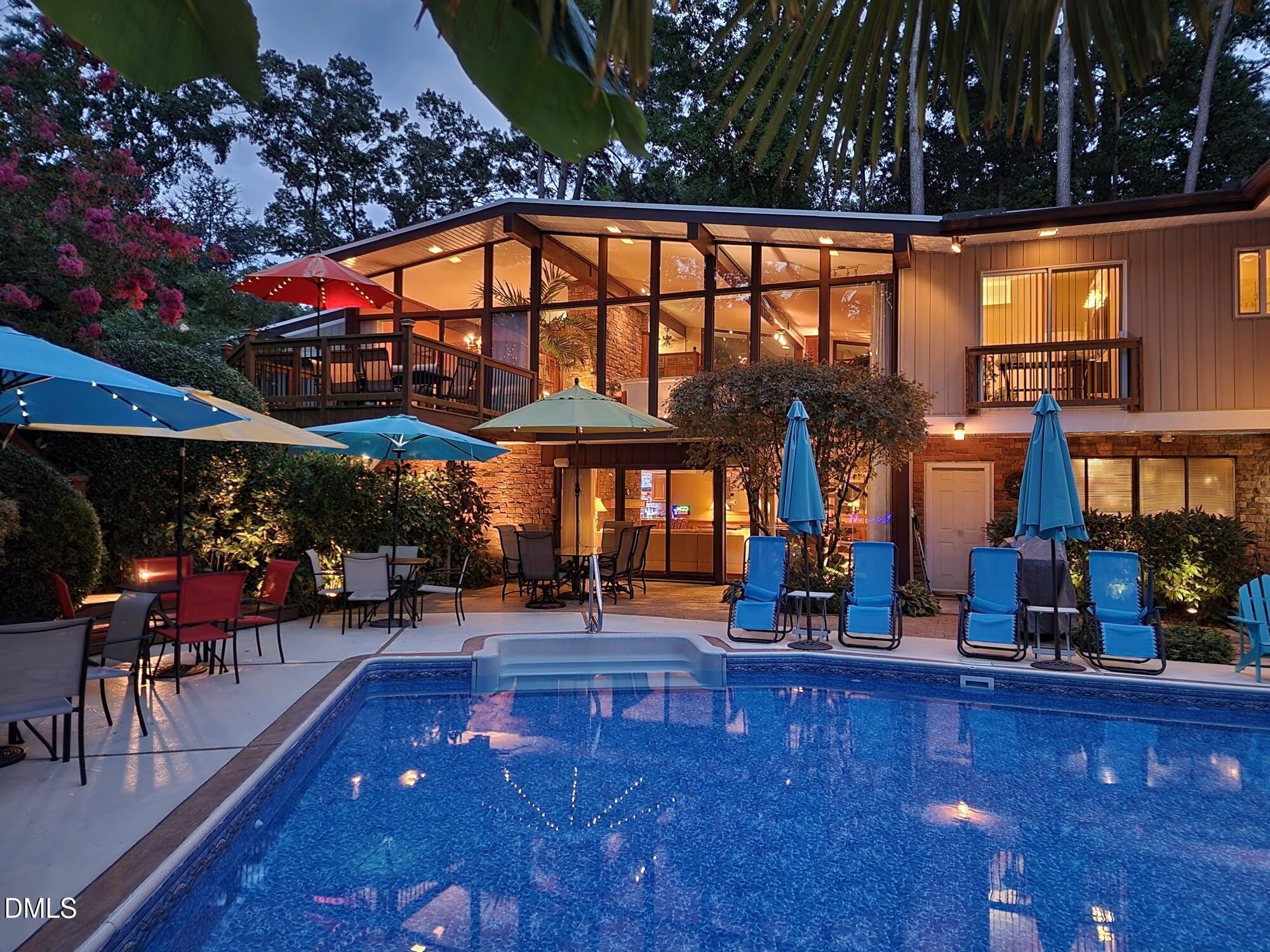 5219 Coronado Drive Raleigh, NC 27609 - Photo 39 of 100 Night time back of house and pool 202207