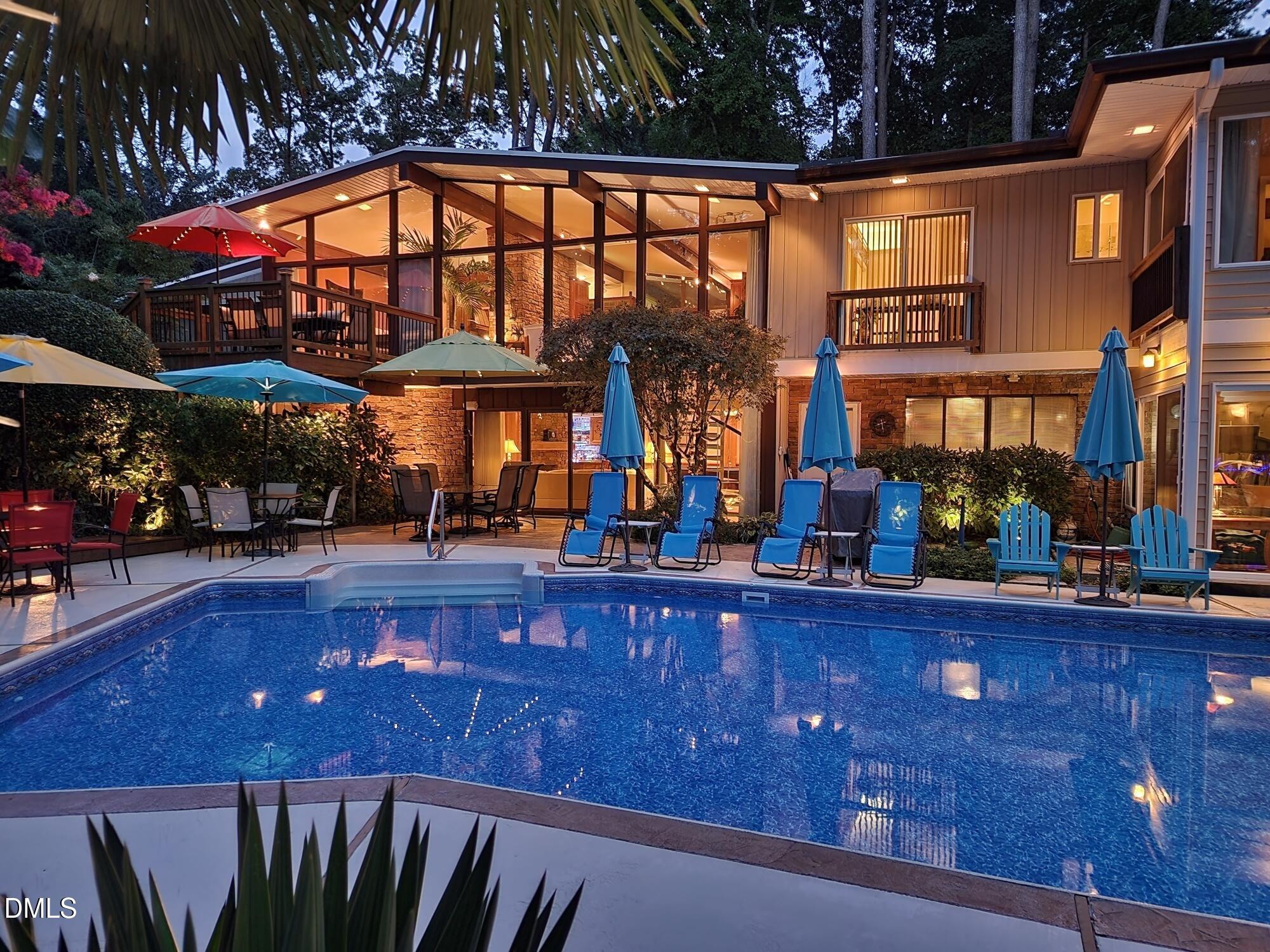 5219 Coronado Drive Raleigh, NC 27609 - Photo 40 of 100 Night time Back of house and pool 202207