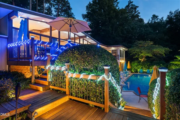 a bathroom with a granite countertop toilet sink and mirror