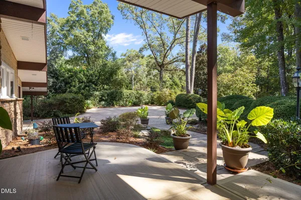 a view of a chairs and table in a patio