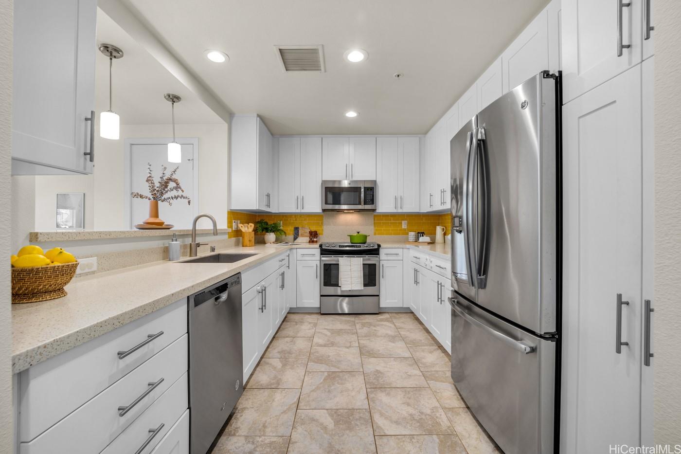 455 Kailua Road, Unit 4101 Kailua, HI 96734 - Photo 1 of 1 a kitchen with stainless steel appliances a refrigerator sink and microwave