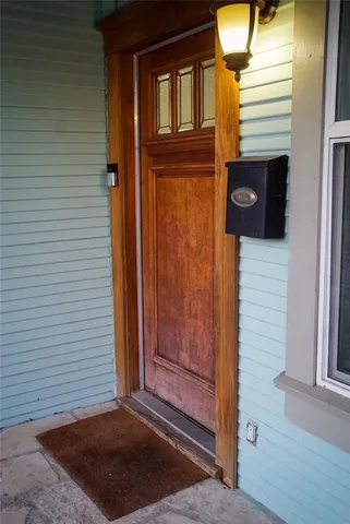 a view of a entryway door front of a house