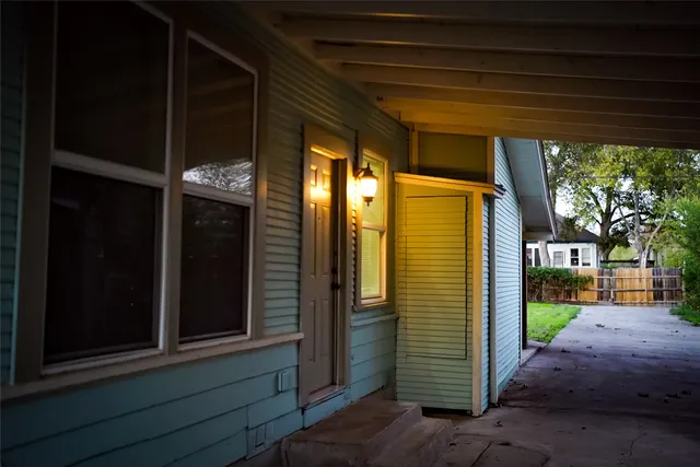 a view of a door with a street sign