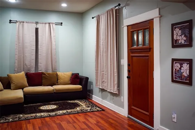 a living room with furniture and a rug