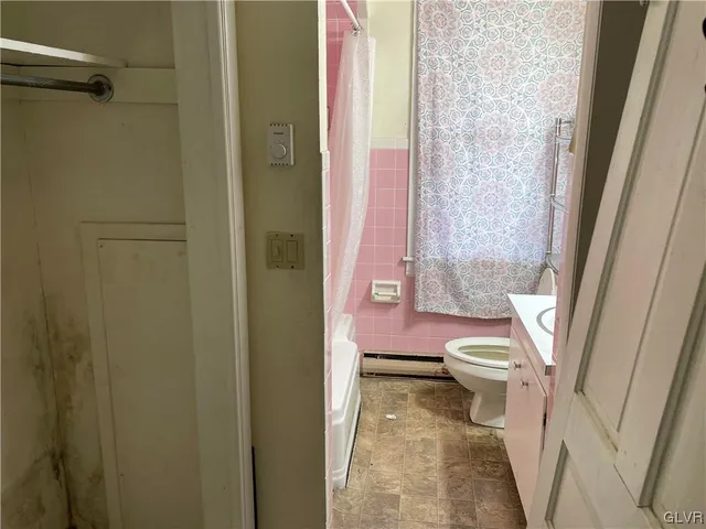 a bathroom with a sink and toilet