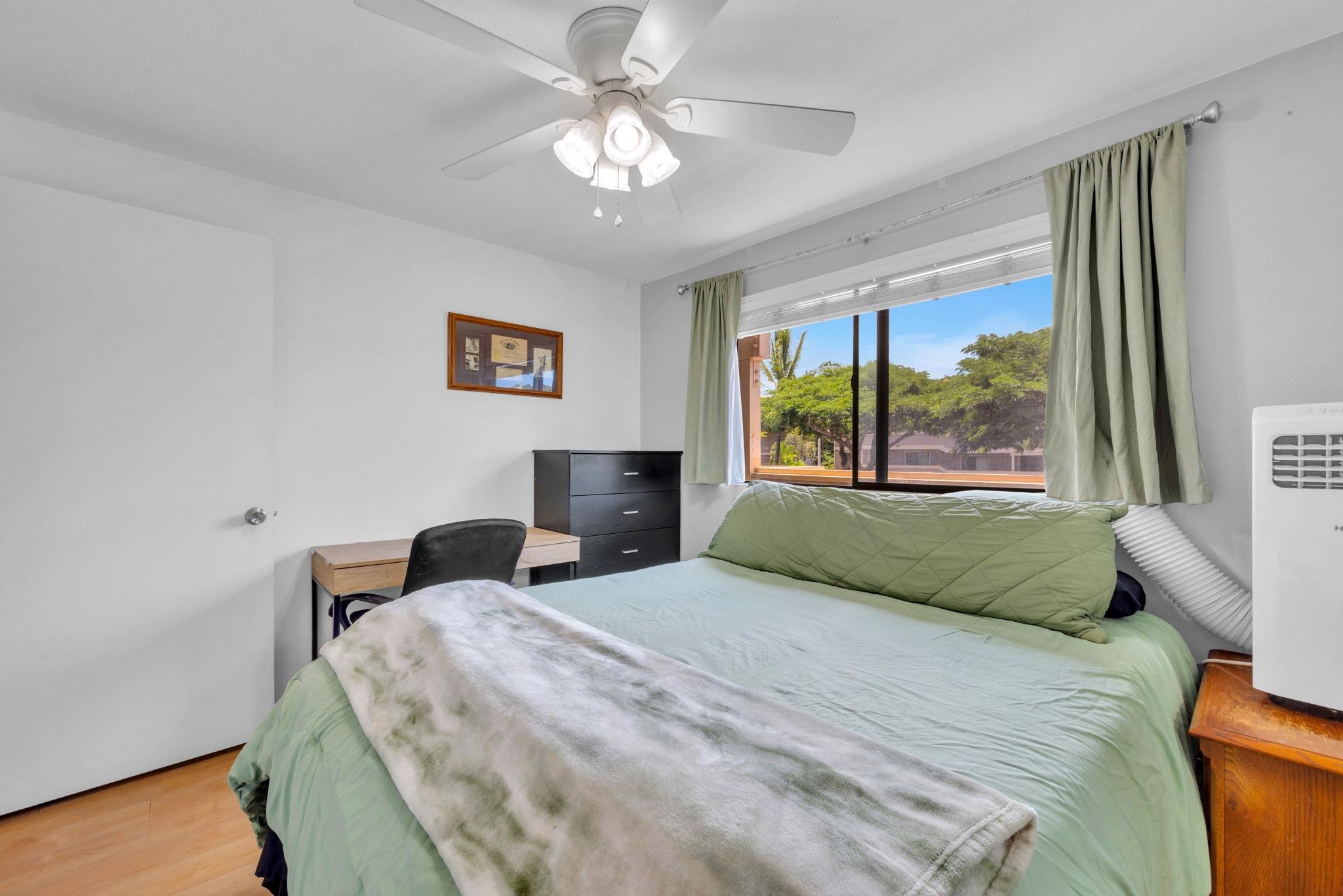 2747 South Kihei Road, Unit C205 Kihei, HI 96753 - Photo 16 of 49 a bedroom with a large bed and a large window